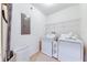 Clean laundry room, washer, dryer, and storage at 4723 Terrasonesta Dr, Davenport, FL 33837