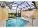 Inviting private screened pool with lounge chairs at 4723 Terrasonesta Dr, Davenport, FL 33837