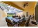 Relaxing screened patio with pool, table, and seating at 4723 Terrasonesta Dr, Davenport, FL 33837