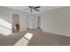 Spacious bedroom featuring a ceiling fan and neutral carpeting at 4731 Capital Blvd, Saint Cloud, FL 34769