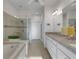 Elegant bathroom with double vanity, soaking tub, and walk-in shower at 580 Cantabria Dr, Davenport, FL 33837