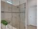 Large walk-in shower with glass enclosure and modern fixtures at 580 Cantabria Dr, Davenport, FL 33837