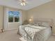 Relaxing bedroom with a king-size bed and ceiling fan at 580 Cantabria Dr, Davenport, FL 33837