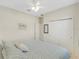 Bright bedroom with a king-size bed and large double door closet at 580 Cantabria Dr, Davenport, FL 33837