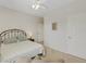 Bright bedroom with a queen-size bed and an ensuite bathroom at 580 Cantabria Dr, Davenport, FL 33837