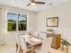 Modern dining room with a sleek wooden table and comfortable seating at 580 Cantabria Dr, Davenport, FL 33837