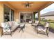 Bright enclosed patio with comfortable seating and access to the living room at 580 Cantabria Dr, Davenport, FL 33837