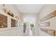 Bright entryway with built-in shelving and mirrors at 580 Cantabria Dr, Davenport, FL 33837