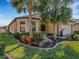 Well-maintained house with attractive landscaping and a two-car garage at 580 Cantabria Dr, Davenport, FL 33837