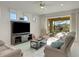 Spacious living area featuring comfortable seating and large screen TV at 580 Cantabria Dr, Davenport, FL 33837