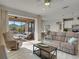 Bright living room with comfortable seating and view of pool at 580 Cantabria Dr, Davenport, FL 33837