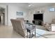 Comfortable living room with sectional sofa and access to lanai at 580 Cantabria Dr, Davenport, FL 33837