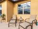 Relaxing patio with seating for two, perfect for enjoying the outdoors at 580 Cantabria Dr, Davenport, FL 33837