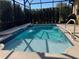 Relaxing, refreshing pool with waterfall feature at 580 Cantabria Dr, Davenport, FL 33837