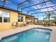 Inviting pool area with covered patio and outdoor seating at 580 Cantabria Dr, Davenport, FL 33837