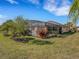 Backyard oasis with screened enclosure and lush greenery at 580 Cantabria Dr, Davenport, FL 33837