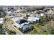 Aerial view of house and neighborhood, highlighting pool and canal at 605 Pinehurst Ct, Kissimmee, FL 34758