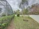 Landscaped backyard with lush greenery at 605 Pinehurst Ct, Kissimmee, FL 34758