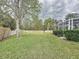 Large backyard with grassy area and fence at 605 Pinehurst Ct, Kissimmee, FL 34758