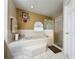 Bathroom with a soaking tub, shower, and updated fixtures at 605 Pinehurst Ct, Kissimmee, FL 34758