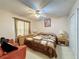 Primary bedroom with king-size bed and sitting area at 605 Pinehurst Ct, Kissimmee, FL 34758