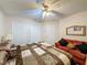 Spacious bedroom with double bed and sitting area at 605 Pinehurst Ct, Kissimmee, FL 34758
