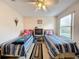 Bedroom with twin beds, ceiling fan and ample closet space at 605 Pinehurst Ct, Kissimmee, FL 34758