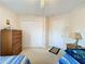 Bedroom with twin beds, ceiling fan and ample closet space at 605 Pinehurst Ct, Kissimmee, FL 34758