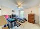 Bedroom with twin beds, dresser, and window at 605 Pinehurst Ct, Kissimmee, FL 34758