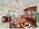 Bright dining room featuring a formal wood table and hutch at 605 Pinehurst Ct, Kissimmee, FL 34758