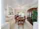 Elegant dining room features a large table, hutch, and chandelier at 605 Pinehurst Ct, Kissimmee, FL 34758