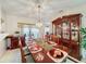 Formal dining room with a wood table, hutch, and chandelier at 605 Pinehurst Ct, Kissimmee, FL 34758