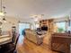 Open living area with hardwood floors, comfortable seating, and access to a patio at 605 Pinehurst Ct, Kissimmee, FL 34758