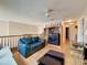 Open loft with a couch, built-in shelving, and hardwood floors at 605 Pinehurst Ct, Kissimmee, FL 34758