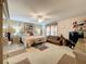 Large main bedroom with a king-size bed and sitting area at 605 Pinehurst Ct, Kissimmee, FL 34758