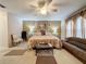 Large main bedroom with a king-size bed and sitting area at 605 Pinehurst Ct, Kissimmee, FL 34758