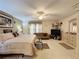 Spacious main bedroom featuring a king bed, sitting area and tv at 605 Pinehurst Ct, Kissimmee, FL 34758