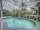 Inviting screened-in pool with a fountain feature at 605 Pinehurst Ct, Kissimmee, FL 34758