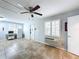 Living room with ceiling fan, tile floors, and a window with shutters at 668 Caribbean Dr, Davenport, FL 33897