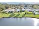 Aerial view of houses near a lake, showcasing a peaceful community setting at 7761 Fort Mchenry Ct, Orlando, FL 32822