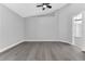 Spacious bedroom with gray walls and wood-look floors at 7761 Fort Mchenry Ct, Orlando, FL 32822