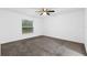 Bright bedroom featuring carpet flooring and large window at 832 Marion Oaks Mnr, Ocala, FL 34473