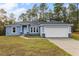 Newly built home with a two-car garage and landscaped yard at 832 Marion Oaks Mnr, Ocala, FL 34473