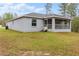 Gray house exterior with screened porch and steps at 832 Marion Oaks Mnr, Ocala, FL 34473