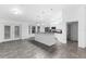 Open concept kitchen with island and access to backyard patio at 832 Marion Oaks Mnr, Ocala, FL 34473