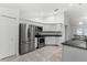 Modern kitchen with stainless steel appliances and ample cabinet space at 832 Marion Oaks Mnr, Ocala, FL 34473