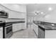 Spacious kitchen with granite countertops and white cabinets at 832 Marion Oaks Mnr, Ocala, FL 34473