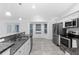 Eat-in kitchen with stainless steel appliances and granite countertops at 832 Marion Oaks Mnr, Ocala, FL 34473