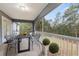 Screened-in patio with outdoor dining set overlooking lush backyard at 832 Marion Oaks Mnr, Ocala, FL 34473