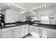 Double vanity bathroom with updated countertops and large mirrors at 1201 Winding Willow Ct, Kissimmee, FL 34746